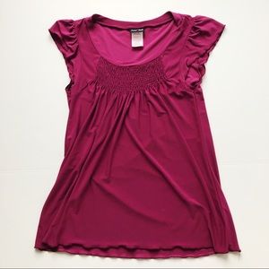 Magenta tunic with ruffle detail. Size medium